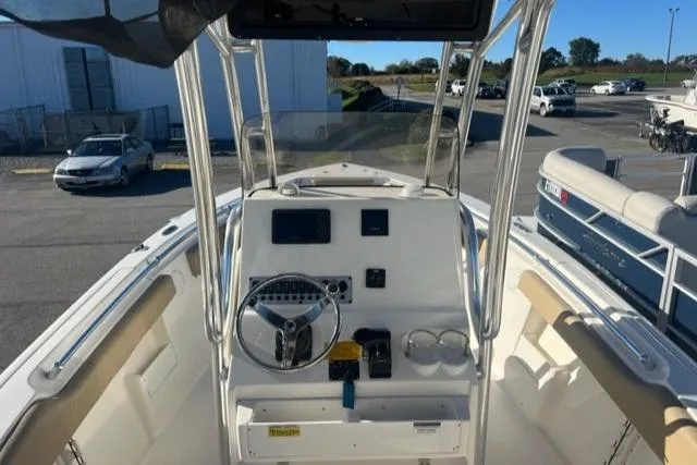Slide: The Image of 2020 Key West 239 FS boat cockpit with steering wheel and control panel. - 3
