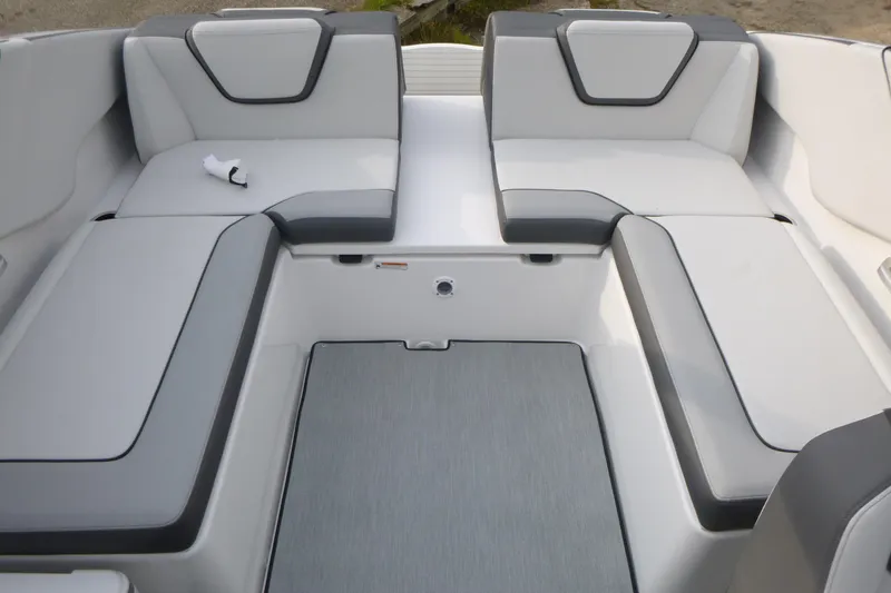 Slide: The Image of 2026 Yamaha Boats AR250 interior seating with gray and white upholstery. - 12