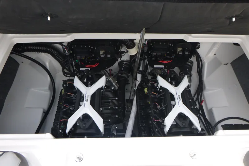 Slide: The Image of 2026 Yamaha AR250 boat engine compartment with dual engines and wiring. - 13