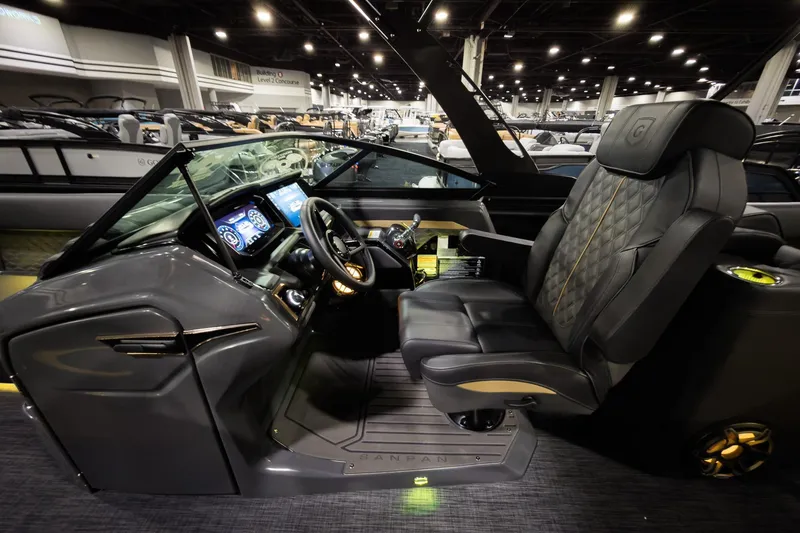 Slide: The Image of Luxurious interior of 2026 Godfrey SanPan 25' Split Bench Windshield boat, featuring modern dashboard. - 13