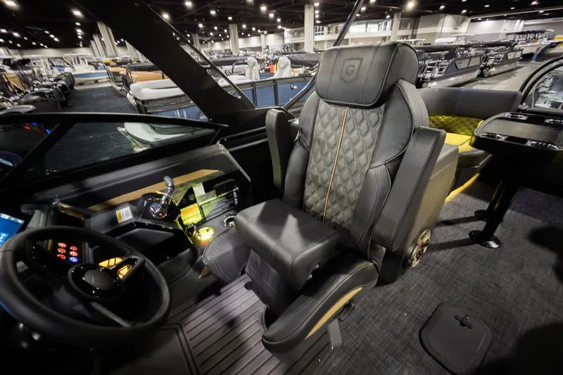 Slide: The Image of Luxurious interior of 2026 Godfrey SanPan 25' Split Bench Windshield boat. - 14