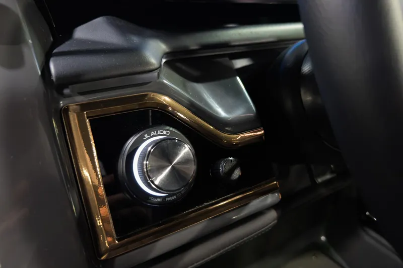 Slide: The Image of Close-up of JL Audio control knob in 2026 Godfrey SanPan 2500 SBW boat. - 16