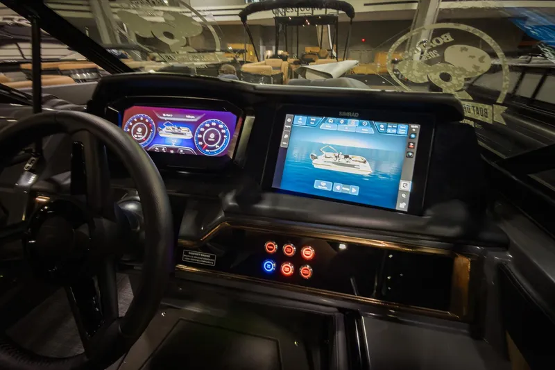 Slide: The Image of Dashboard of 2026 Godfrey SanPan 25' Split Bench Windshield boat with digital displays. - 17