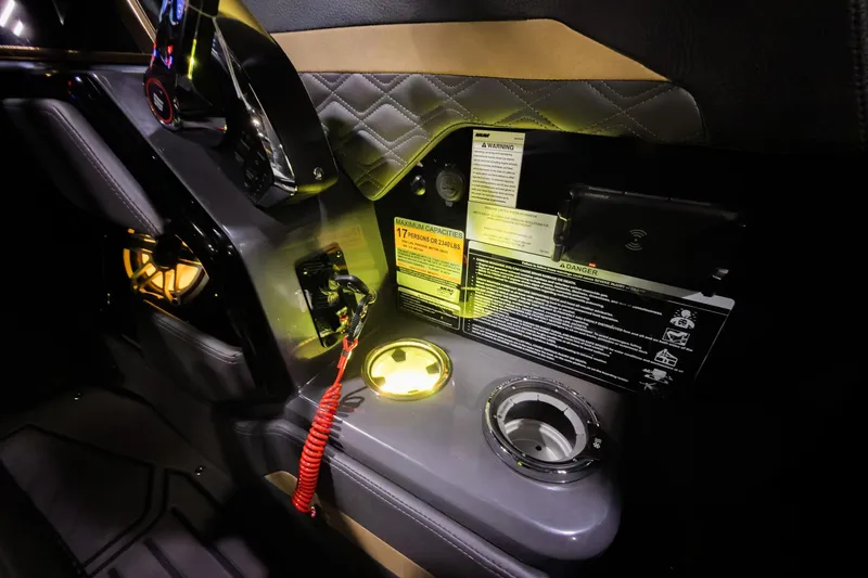 Slide: The Image of Interior of 2026 Godfrey SanPan 25' Split Bench Windshield with illuminated controls and cup holder. - 20