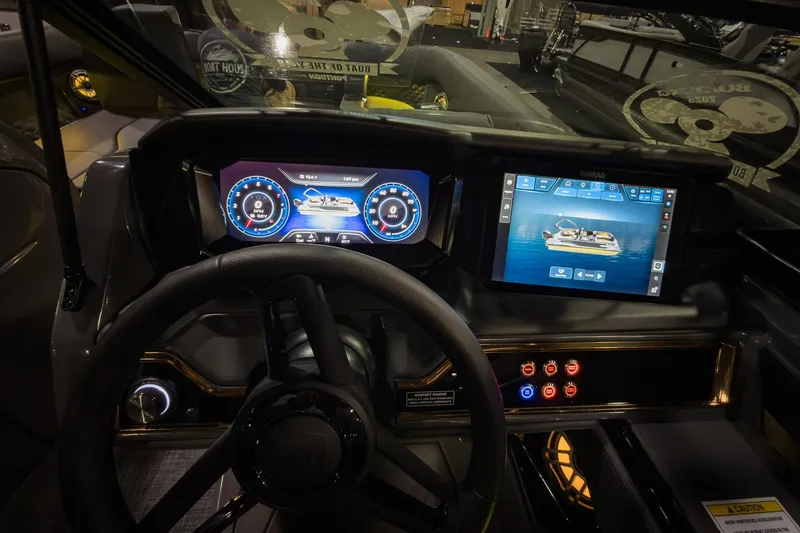 Slide: The Image of Dashboard of 2026 Godfrey SanPan 25' Split Bench Windshield boat with digital displays. - 21