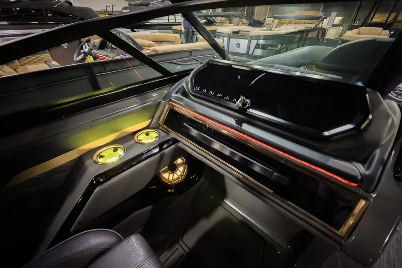 Slide: The Image of 2026 Godfrey SanPan 2500 SBW interior with sleek dashboard and illuminated cup holders. - 24