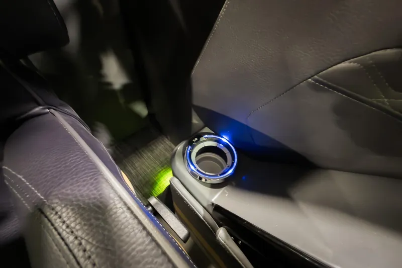 Slide: The Image of Illuminated cup holder in 2026 Godfrey SanPan 25' Split Bench Windshield boat interior. - 26