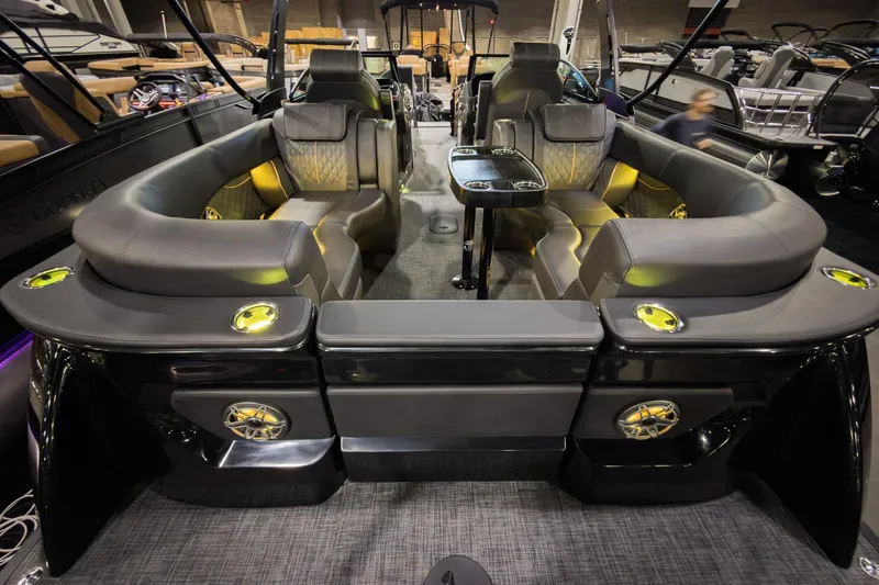 Slide: The Image of Luxurious 2026 Godfrey SanPan 25' pontoon boat interior with split bench seating and modern design. - 34