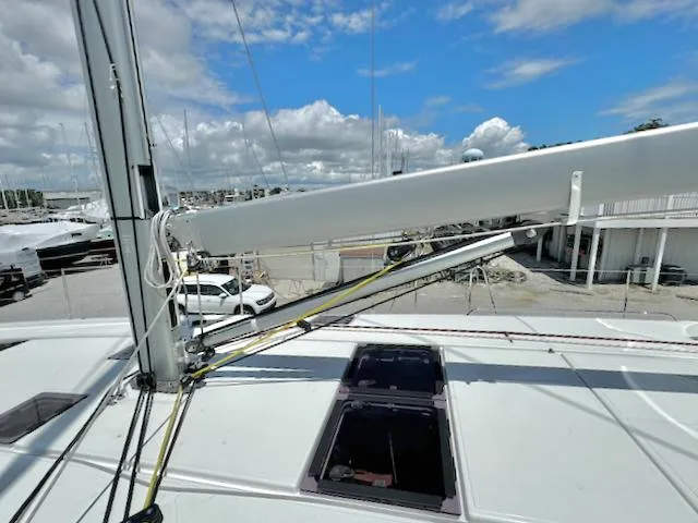 Slide: The Image of 2023 Jeanneau Sun Odyssey 490 sailboat deck with mast and rigging under blue sky. - 15