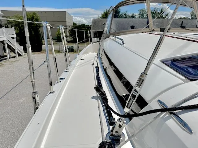 Slide: The Image of 2023 Jeanneau Sun Odyssey 490 sailboat deck, showcasing sleek design and modern features. - 19