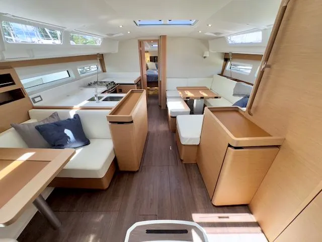 Slide: The Image of Interior of 2023 Jeanneau Sun Odyssey 490 yacht, featuring modern design and spacious seating. - 26