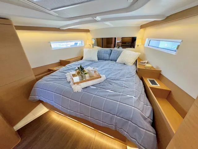 Slide: The Image of Luxurious cabin interior of 2023 Jeanneau Sun Odyssey 490 yacht with cozy bedding. - 30