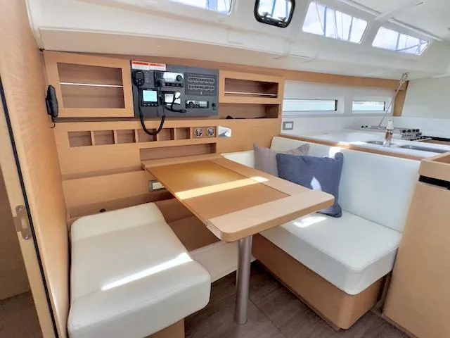 Slide: The Image of Interior of 2023 Jeanneau Sun Odyssey 490 yacht with modern seating and navigation equipment. - 34