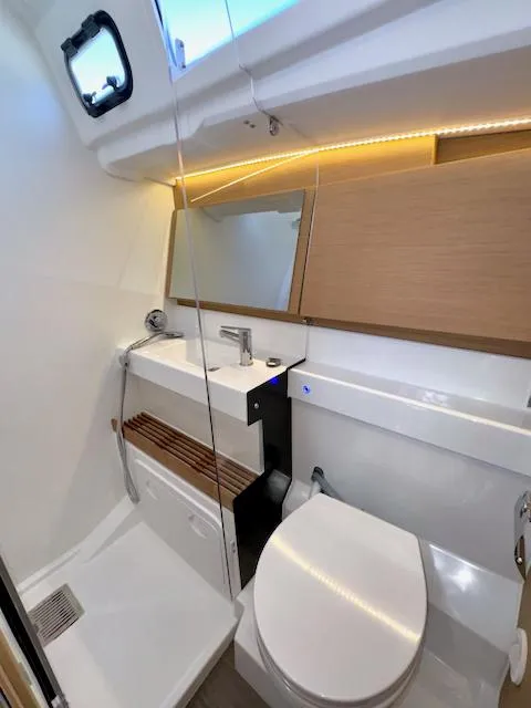 Slide: The Image of Modern bathroom in 2023 Jeanneau Sun Odyssey 490 yacht with sleek fixtures and ambient lighting. - 35