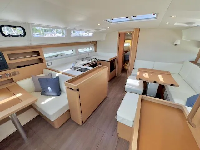 Slide: The Image of Luxurious interior of 2023 Jeanneau Sun Odyssey 490 yacht with modern kitchen and seating area. - 39
