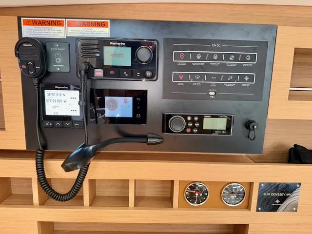 Slide: The Image of Control panel of 2023 Jeanneau Sun Odyssey 490 yacht with navigation and communication equipment. - 40