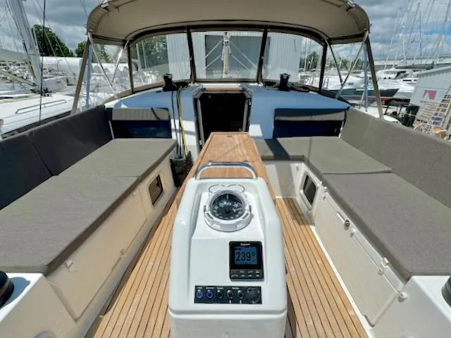 Slide: The Image of 2023 Jeanneau Sun Odyssey 490 cockpit with modern navigation equipment and comfortable seating. - 8
