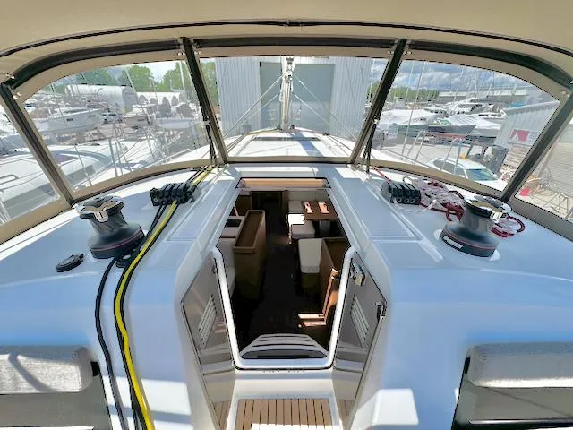 Slide: The Image of 2023 Jeanneau Sun Odyssey 490 yacht cockpit with open cabin view. - 9