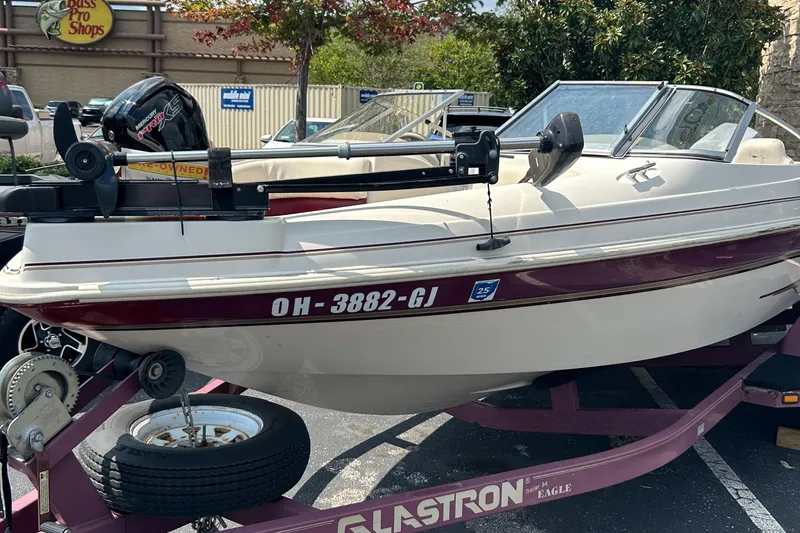 Slide: The Image of 1999 Glastron GS185 SF boat on trailer, parked near Bass Pro Shops. - 1