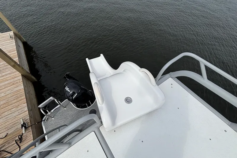 Slide: The Image of Boat slide on 2025 Godfrey MC235SDB, leading into water near dock. - 11