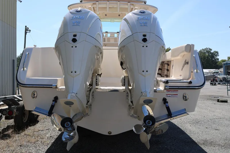 Slide: The Image of 2026 Grady-White Canyon 306 boat with dual Yamaha 350 V6 engines, rear view. - 7