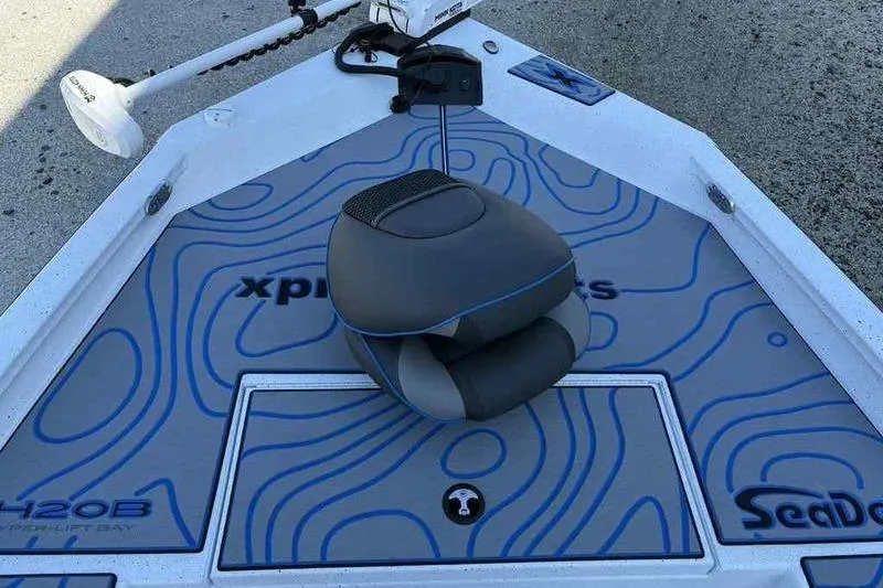Slide: The Image of 2026 Xpress H20B Bay boat deck with seat and SeaDek flooring. - 11