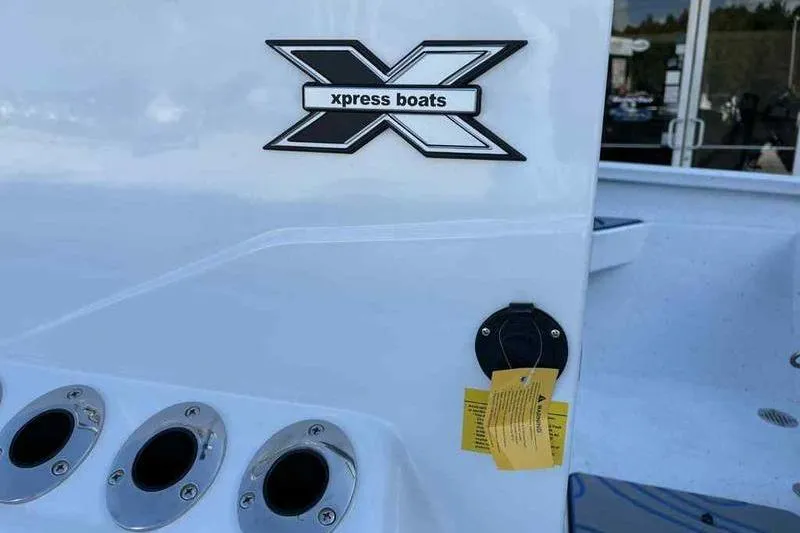 Slide: The Image of 2026 Xpress H20B Bay boat logo and details on white surface. - 12