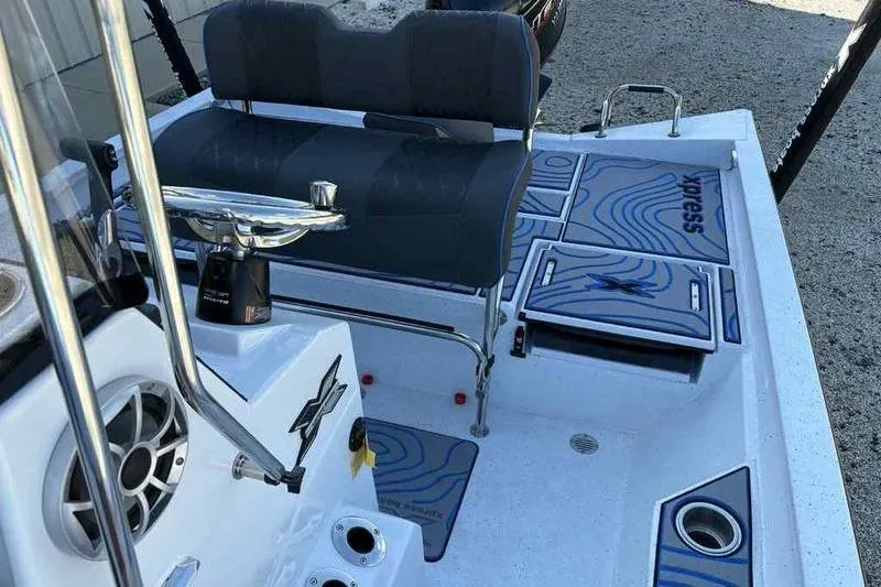 Slide: The Image of 2026 Xpress H20B Bay boat interior with seating and storage compartments. - 15