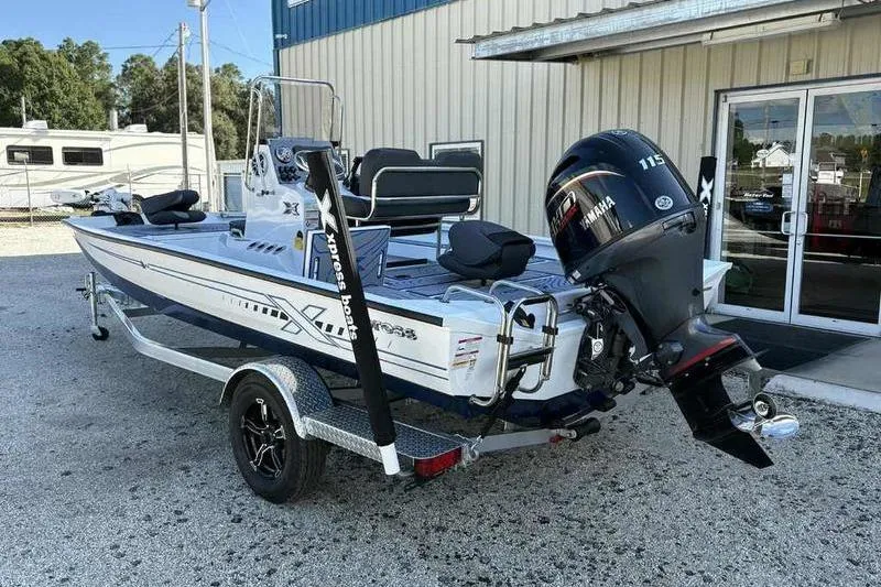 Slide: The Image of 2026 Xpress H20B Bay boat with Yamaha 115 engine on trailer. - 6