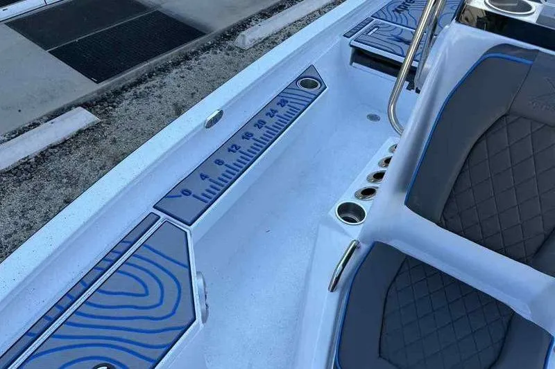 Slide: The Image of 2026 Xpress H20B Bay boat interior with seating and measurement scale. - 9