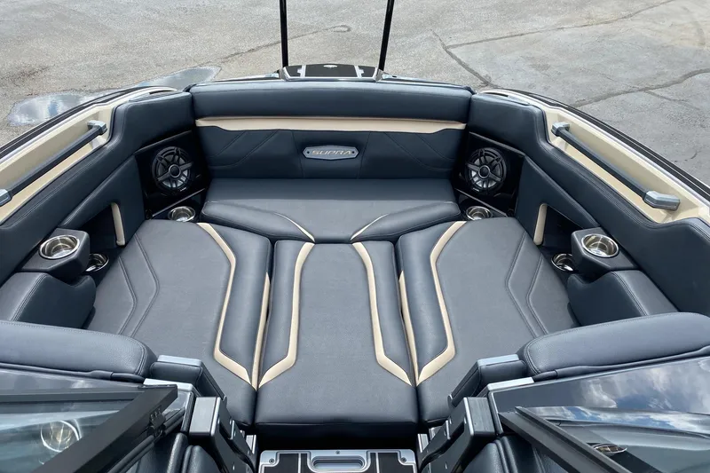 Slide: The Image of 2023 Supra SE450 boat interior with luxurious seating and built-in speakers. - 11