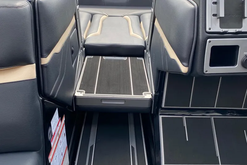 Slide: The Image of 2023 Supra SE450 interior with black and beige leather seats and sleek flooring design. - 12