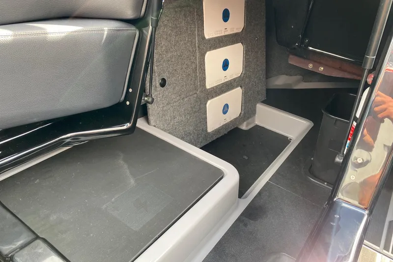 Slide: The Image of Interior of 2023 Supra SE450, showcasing seating and storage compartments. - 14