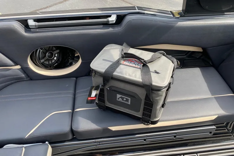 Slide: The Image of 2023 Supra SE450 interior with a cooler bag on the seat. - 16