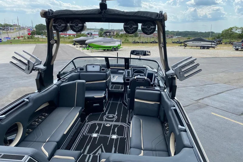 Slide: The Image of 2023 Supra SE450 boat interior with sleek seating and advanced audio system. - 8