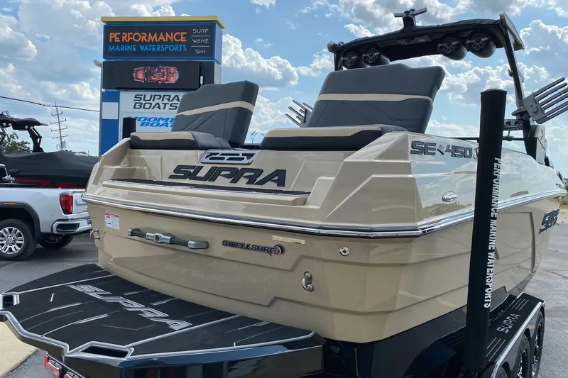 Slide: The Image of 2023 Supra SE450 boat at Performance Marine Watersports dealership, showcasing sleek design and features. - 9