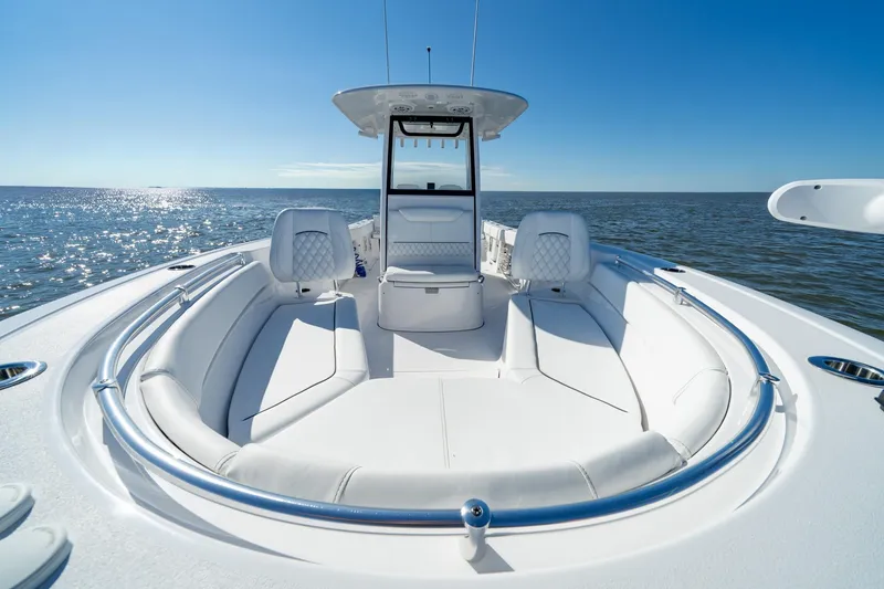 Slide: The Image of 2024 Sportsman Heritage 261 Center Console boat on open water, sunny day. - 14