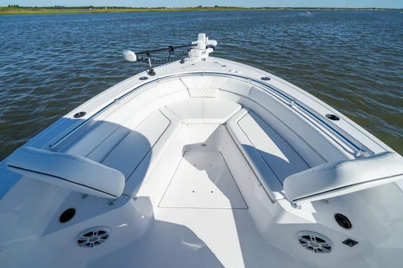 Slide: The Image of 2024 Sportsman Heritage 261 Center Console boat interior on open water. - 16