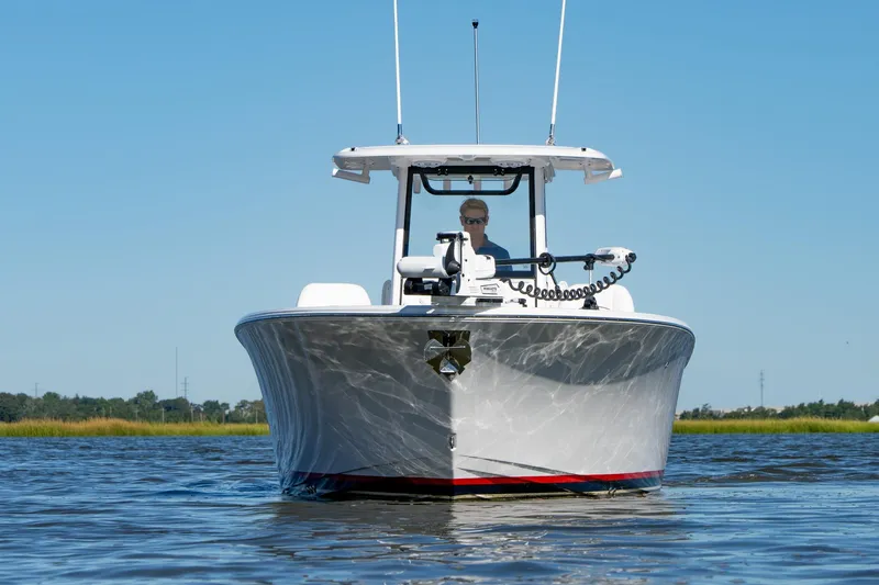 Slide: The Image of 2024 Sportsman Heritage 261 Center Console boat on calm water, front view. - 3