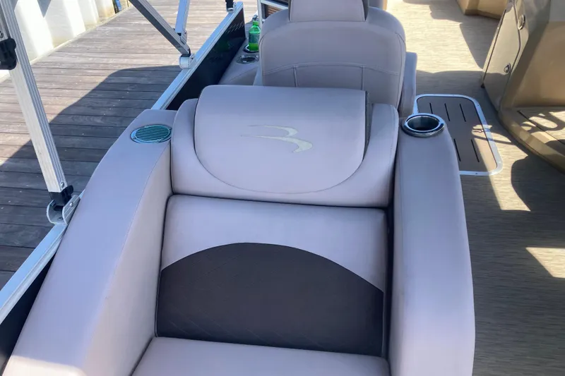 Slide: The Image of Luxurious seating on 2018 Bennington 23 SX boat with cup holders and stylish design. - 24