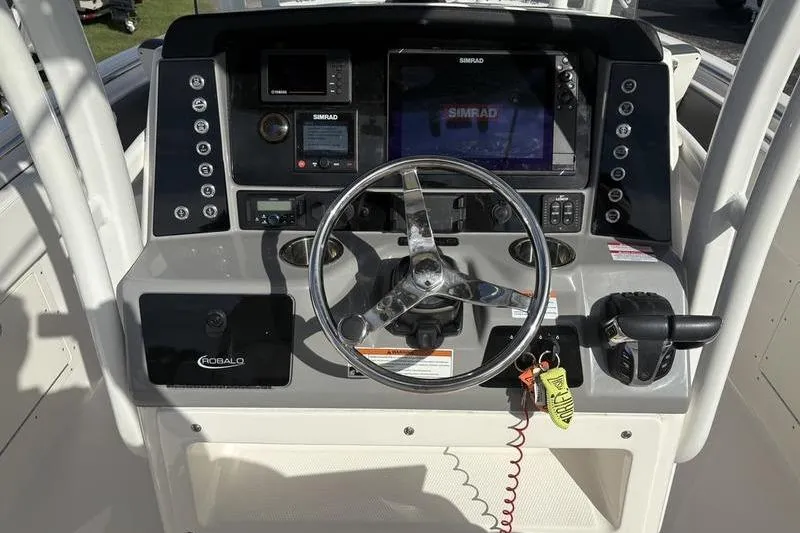 Slide: The Image of Simrad display on 2022 Robalo R242 Center Console showing navigation and engine data. - 20