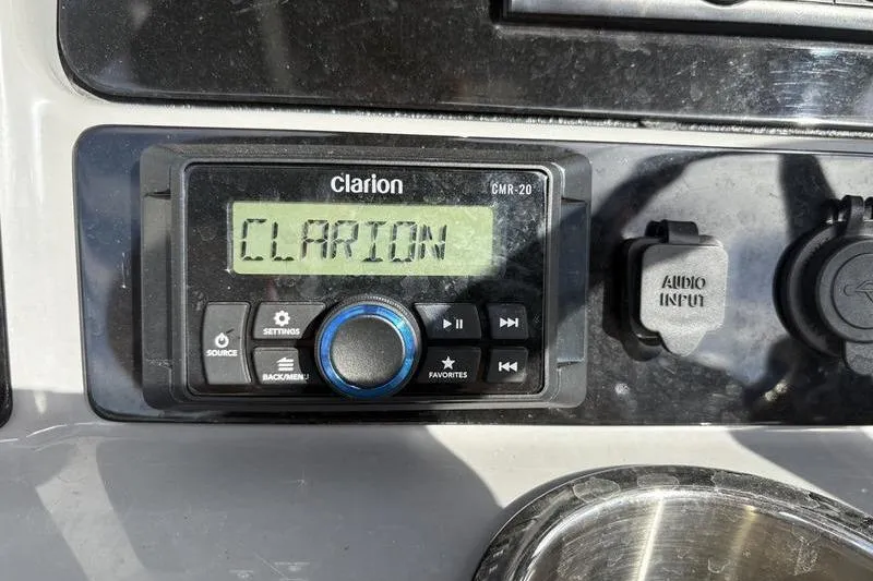 Slide: The Image of 2022 Robalo R242 Center Console boat interior with seating and console details. - 23