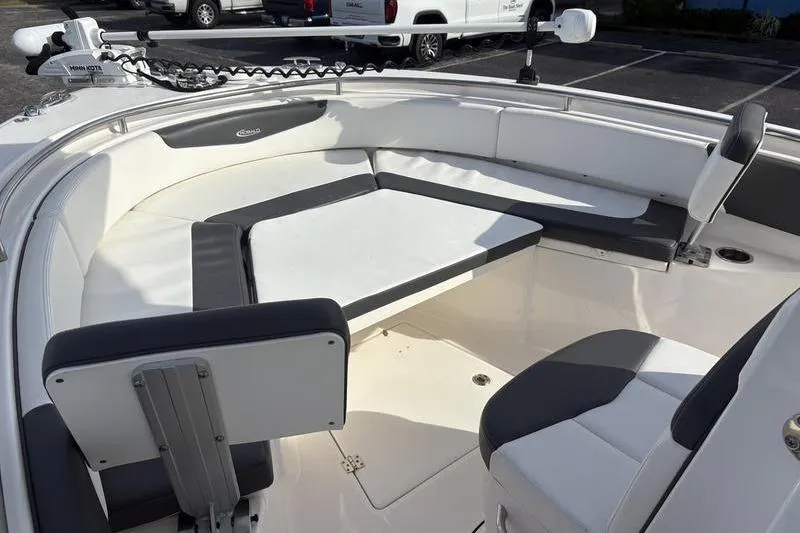 Slide: The Image of 2022 Robalo R242 Center Console boat interior with compact marine toilet. - 26