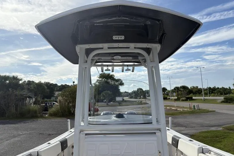 Slide: The Image of 2022 Robalo R242 Center Console boat with spacious seating and modern design. - 29