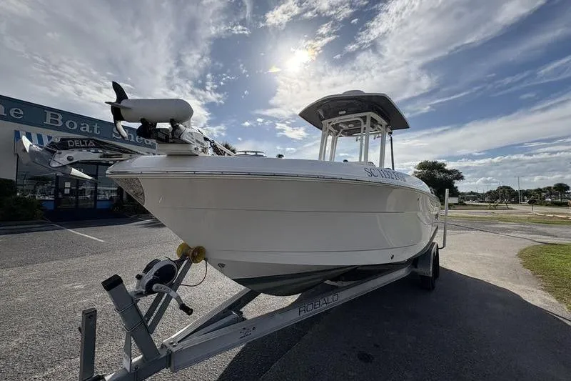 Slide: The Image of 2022 Robalo R242 Center Console boat with Yamaha 200 engines and foldable seating. - 8