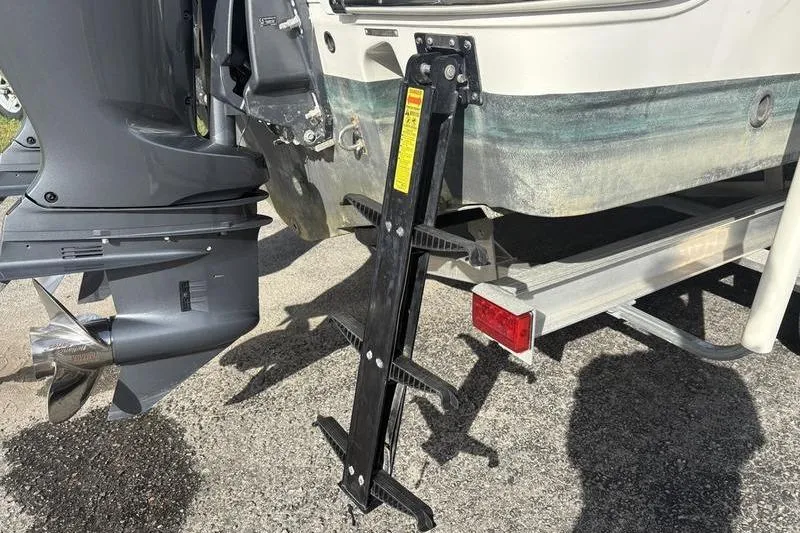 Slide: The Image of 2022 Robalo R242 Center Console boat livewell with transparent lid and secure latch. - 9