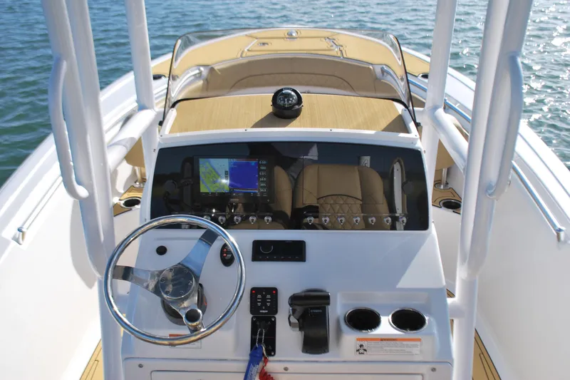 Slide: The Image of 2023 Sportsman Heritage 211 Center Console boat dashboard with navigation system. - 12