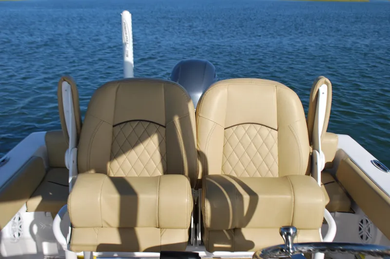 Slide: The Image of 2023 Sportsman Heritage 211 Center Console boat seats on water. - 15