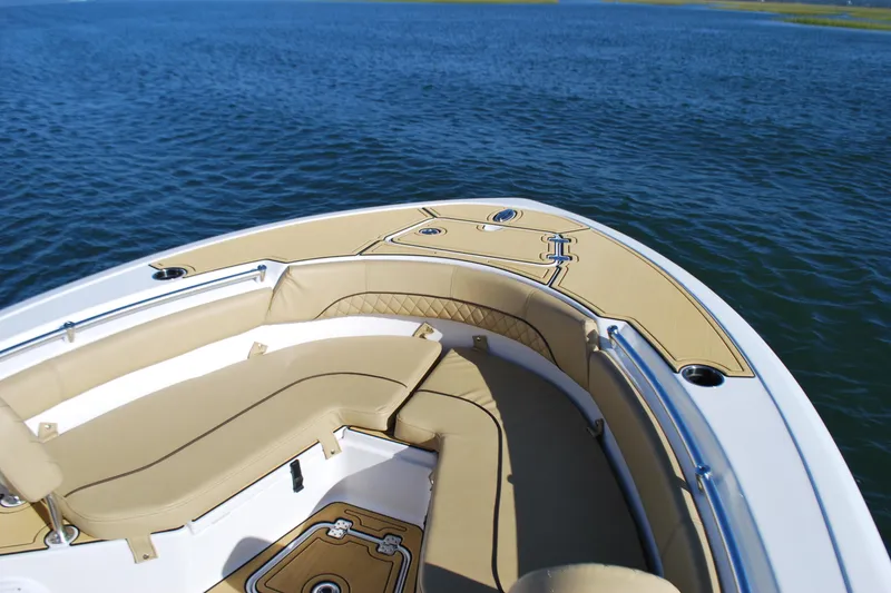 Slide: The Image of 2023 Sportsman Heritage 211 Center Console boat with tan seating on open water. - 6