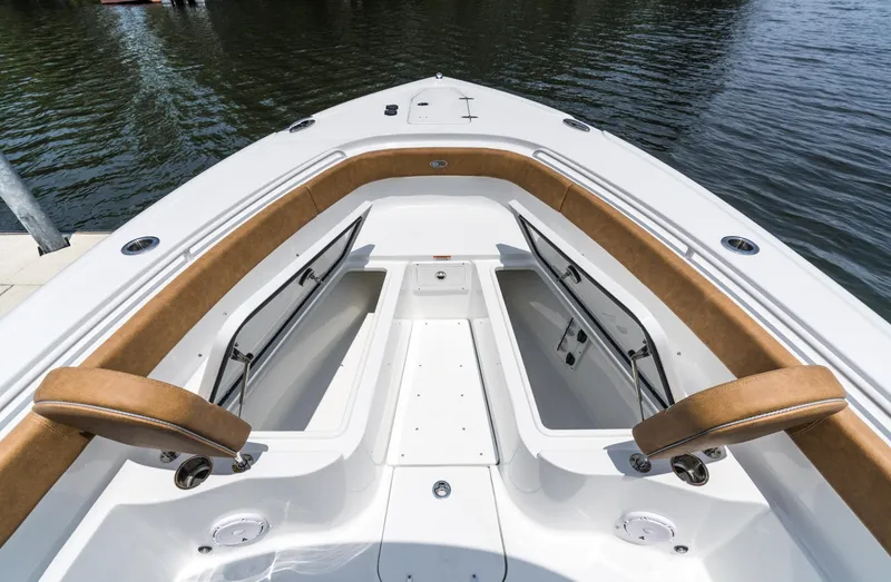 Slide: The Image of 2025 Sea Hunt Ultra 305 SE boat interior with open storage compartments. - 8